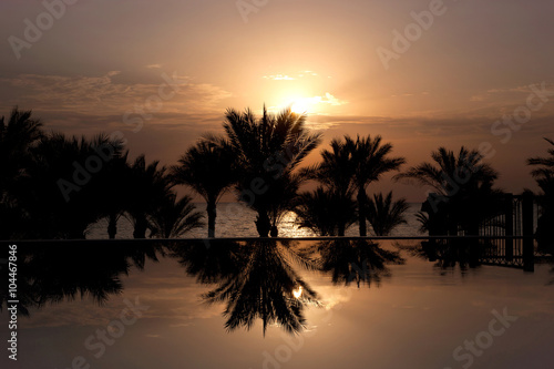 Sunrise over infinity pool