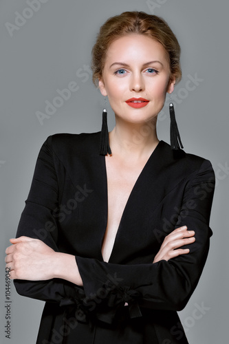 elegant lady in black suit with deep decollete photo