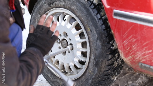 Worker untwists wheel photo