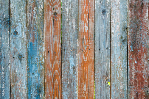 Vintage wood background. Grunge wooden weathered oak or pine textured planks. Rustic green, brown, blue rustic fence.
