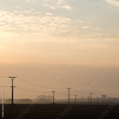 sunset over the fields in fog © Martins Vanags