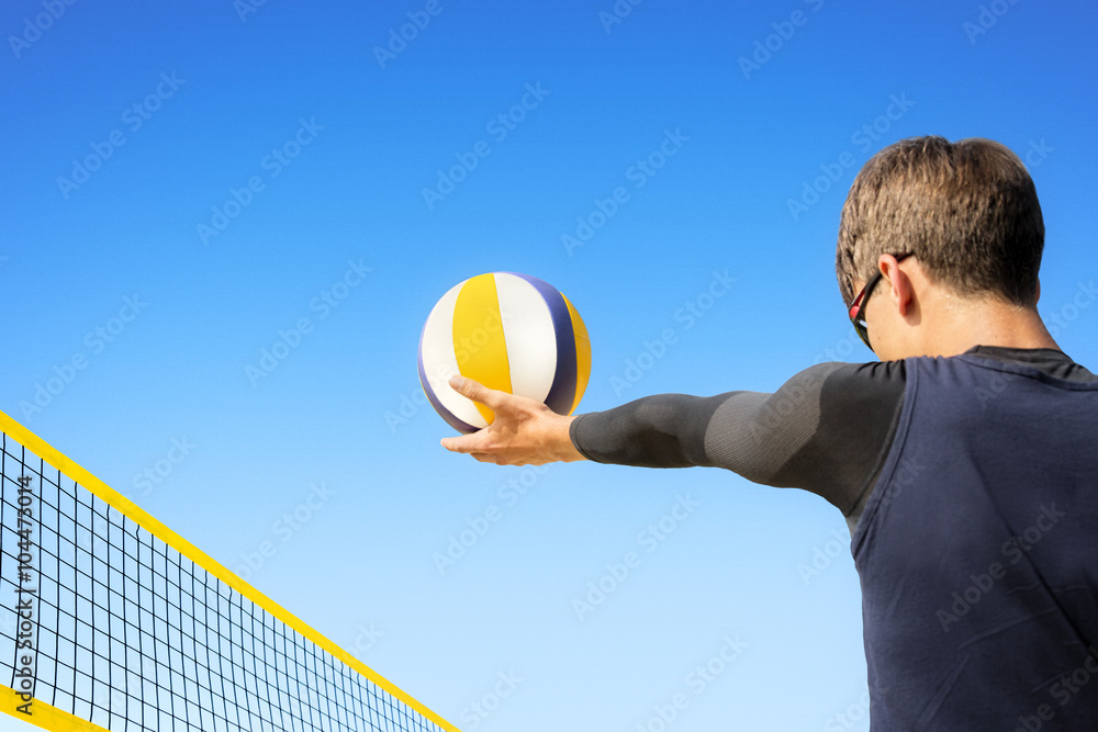 Pitching beach volleyball player