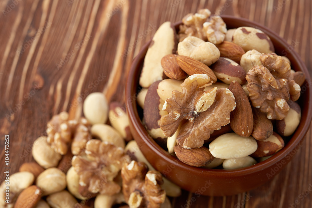 Mix nuts on wooden background Mix nuts on wooden background