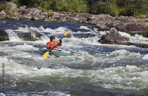 Kayaker in whitewater © Nadezhda Bolotina