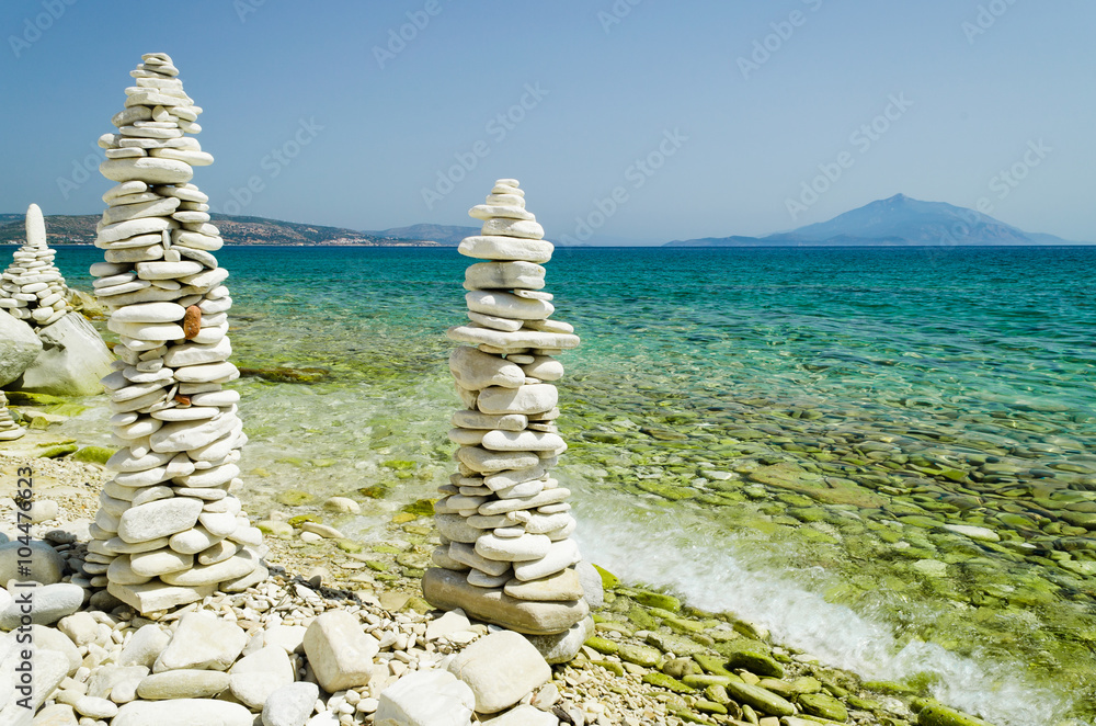 High pebble towers on the beach of the aegean island of Samos