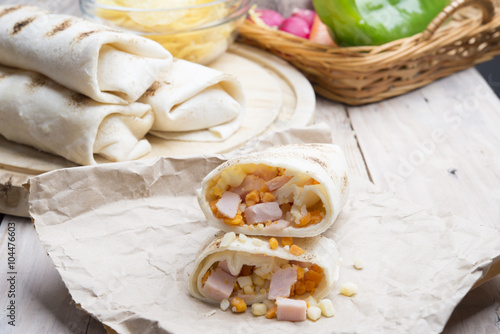 Breakfast burrito with eggs, cheddar, microgreens and roasted mu