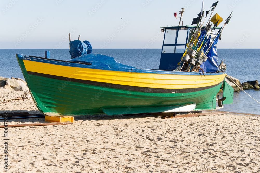 Obraz premium Fishing boat on the coast at Gdynia Orlowo at Baltic sea, Poland