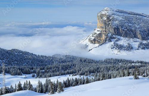 Mont Granier in the Chartreuse mountains above the clouds on a nice day in winter. photo