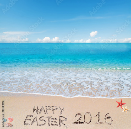 happy easter 2016 on a tropical beach under clouds