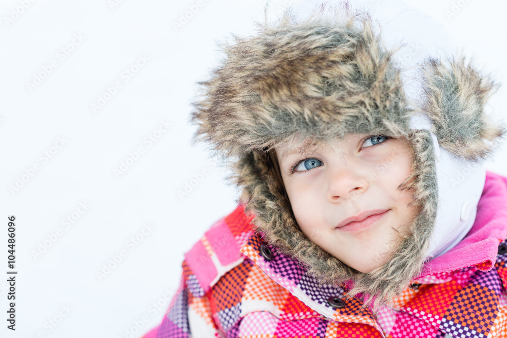 Obraz premium Winter fun - Portrait of adorable happy child girl