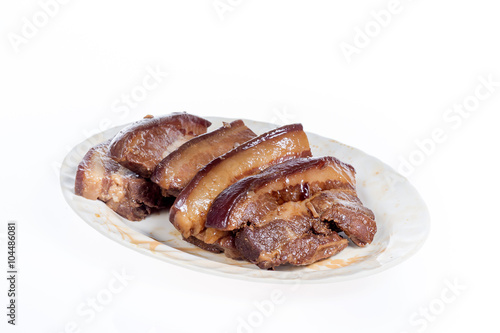soy-stewed pork(chinese food) on a plate isolated on white background