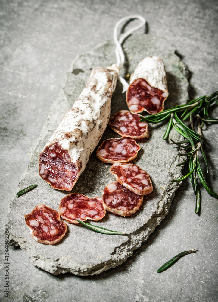 Sliced salami flavored with rosemary and spices. Sliced salami flavored with rosemary and spices.