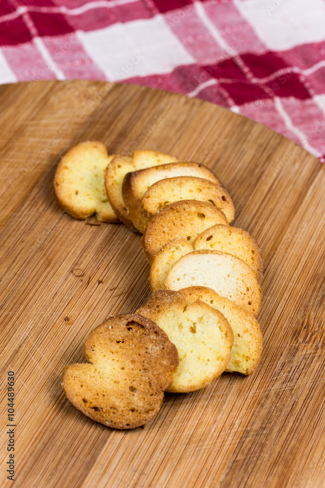 Saulty crispy little toast breads on the wooden board