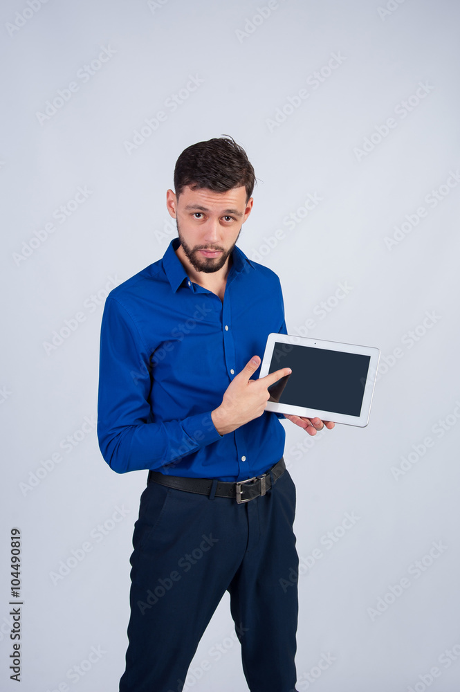 Young man standing with white tablet Young man standing with white tablet