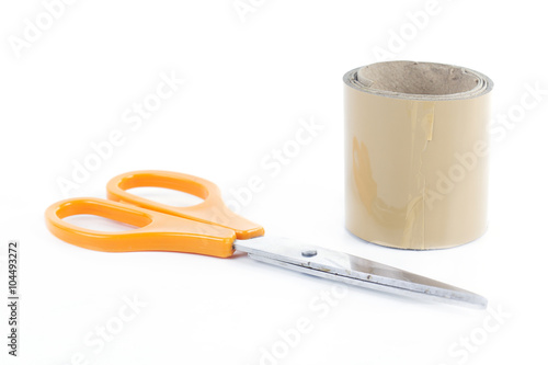 Roll of adhesive tape and scissors