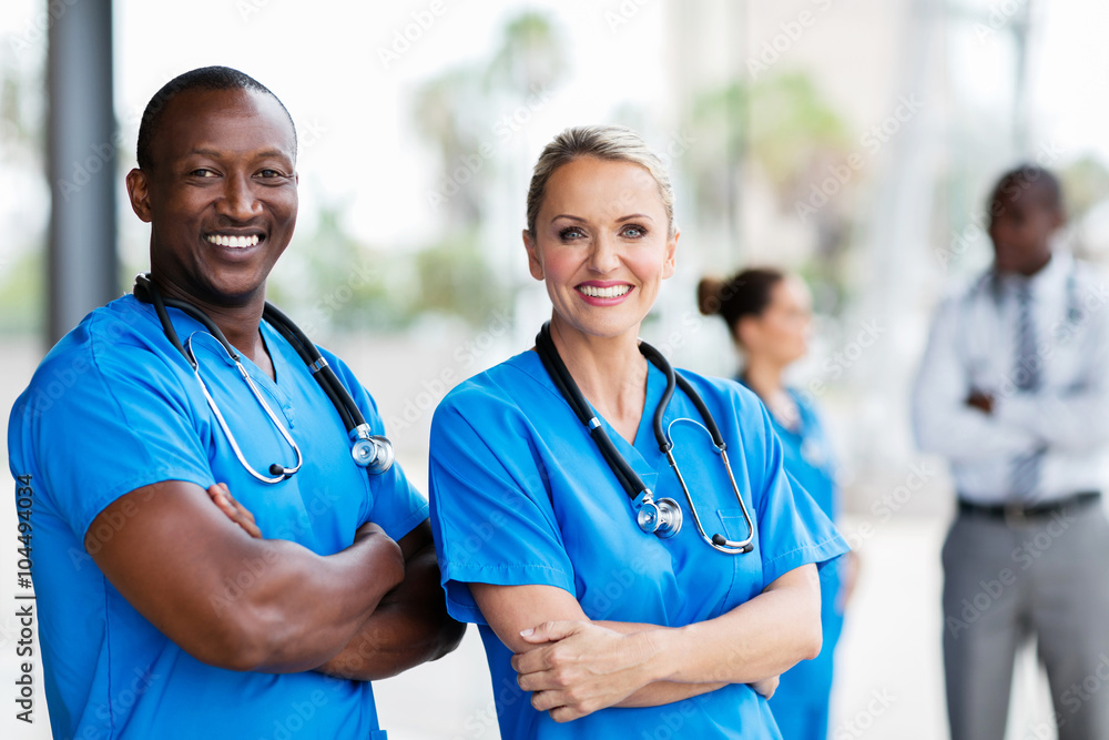 medical co-workers with arms crossed medical co-workers with arms crossed