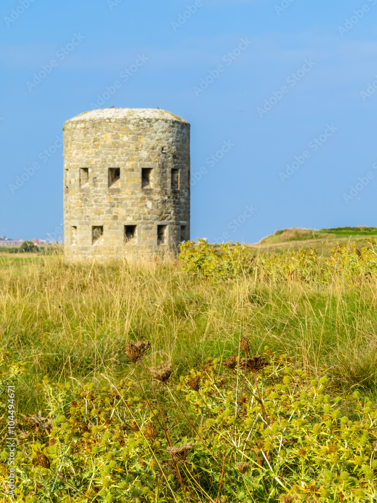 Ancient  watchtower on the seacoast of Guernsey Island