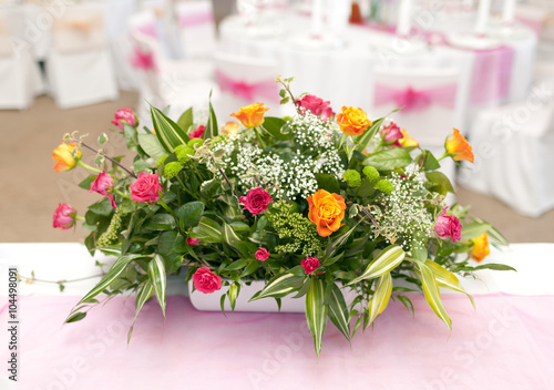 Wedding table with bouquet of roses