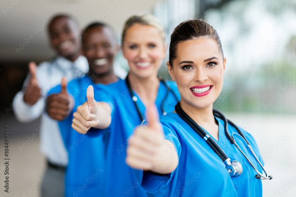 medical team giving thumbs up medical team giving thumbs up