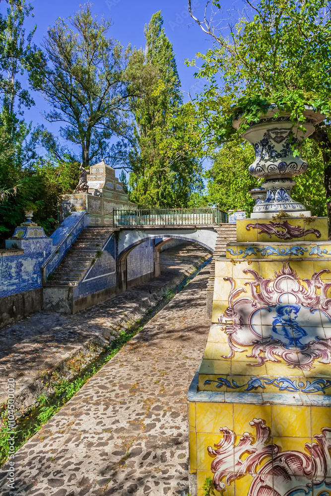 Queluz, Portugal. Queluz palace gardens. The Jamor river canal, decorated with traditional Portuguese tiles. Formerly used as the Summer residence by the Portuguese royal family.