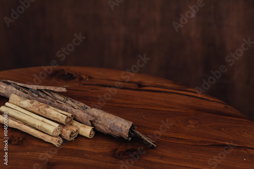 Bunch of cinnamon sticks on wooden table