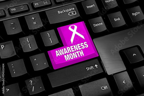 Black Computer keyboard with pink awareness month button