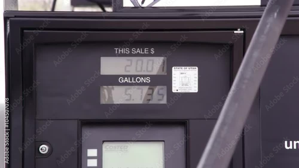 Price and fuel meter running during fill up. Price and fuel meter running during fill up.