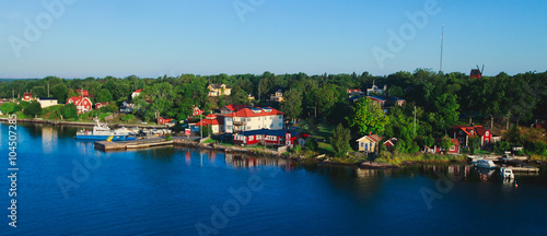 Beautiful super wide-angle panoramic aerial view of Stockholm archipelago, Sweden with harbor and skyline with scenery beyond the city, seen from the ferry, sunny summer day with blue sky photo