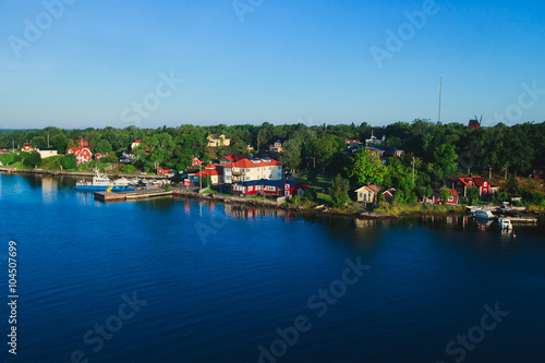 Beautiful super wide-angle panoramic aerial view of Stockholm archipelago, Sweden with harbor and skyline with scenery beyond the city, seen from the ferry, sunny summer day with blue sky © tsuguliev