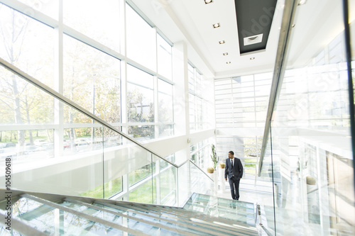 Modern black businessman on the stairs