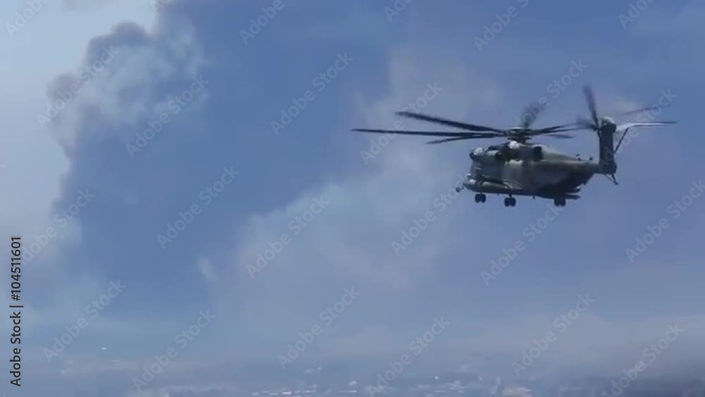 U.S. Marine helicopters combat a wildfire in San Diego County. U.S. Marine helicopters combat a wildfire in San Diego County.