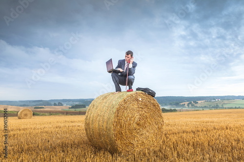 Contemporary businessman farmer in the landscape