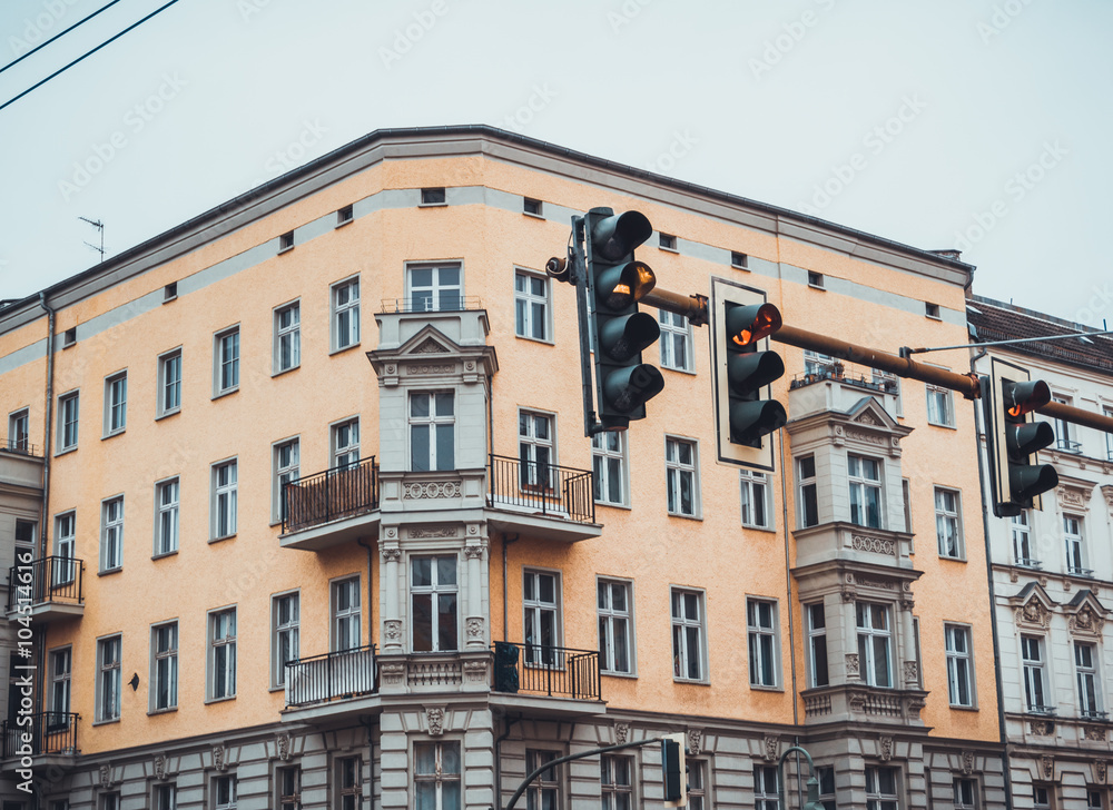 Fototapeta premium Upper Floors of Urban Building with Traffic Lights