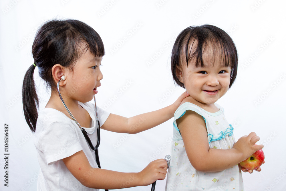Asian Little Chinese Girls Playing as Doctor and Patient with St Asian Little Chinese Girls Playing as Doctor and Patient with St