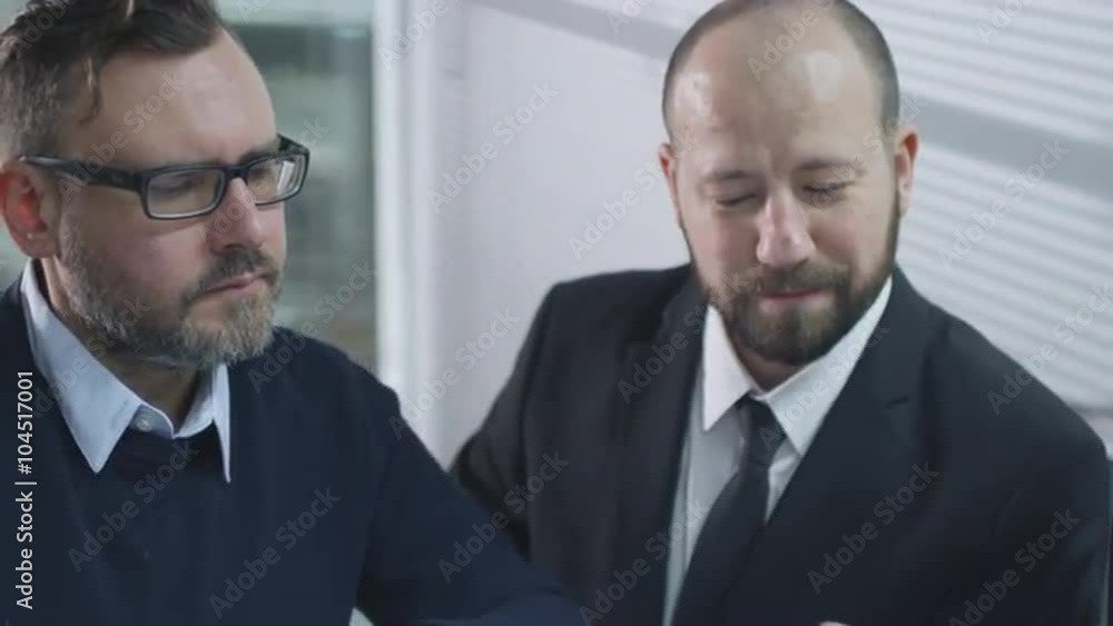 Group of employees are having a conversation in meeting room. Shot on RED Cinema Camera. Group of employees are having a conversation in meeting room. Shot on RED Cinema Camera.
