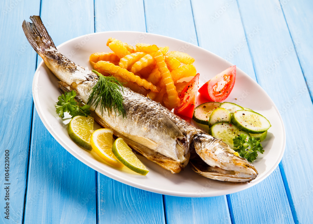 Fish dish - fried fish fillet with vegetables Fish dish - fried fish fillet with vegetables