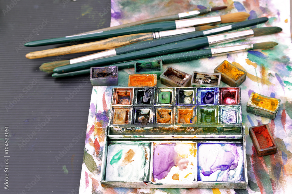 Paints, brushes with palette background Paints, brushes with palette background