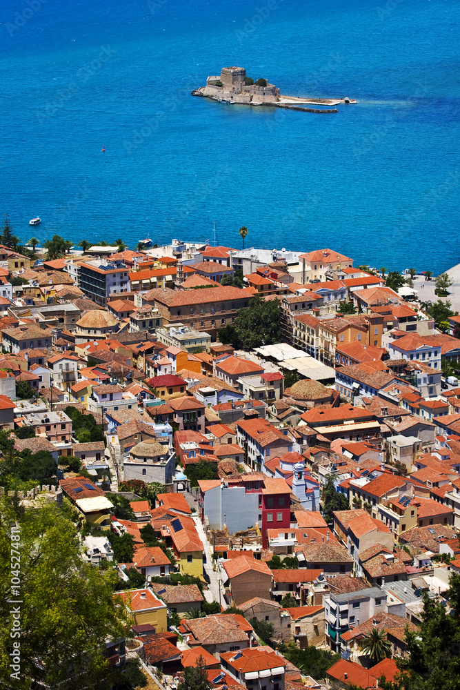 Greece. Nafplio. Aerial view of the old part of the city from Palamidi castle. There is Bourtzi Castle in background