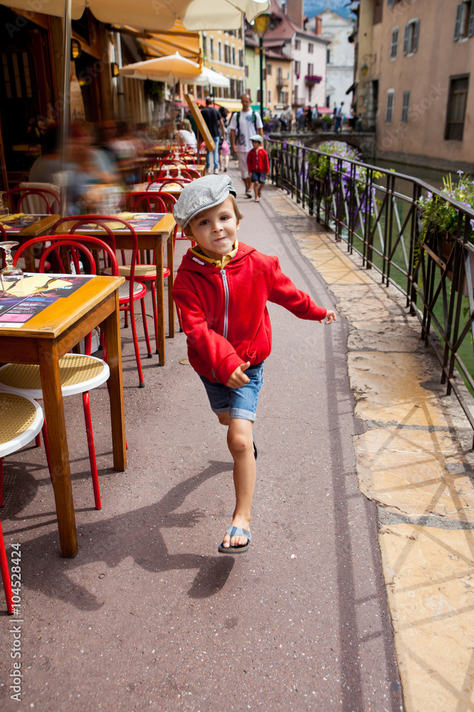 Obraz premium Sweet portrait of preschool boy in the town of Annecy, France, s