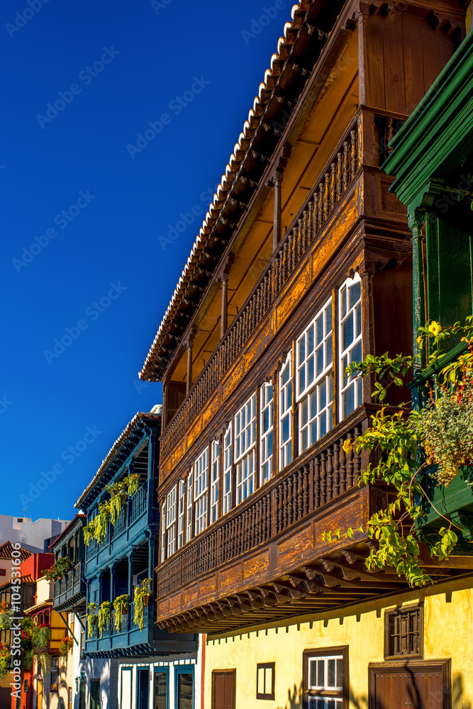 Famous ancient colorful balconies decorated with flowers in Santa Cruz city on La Palma island in Spain