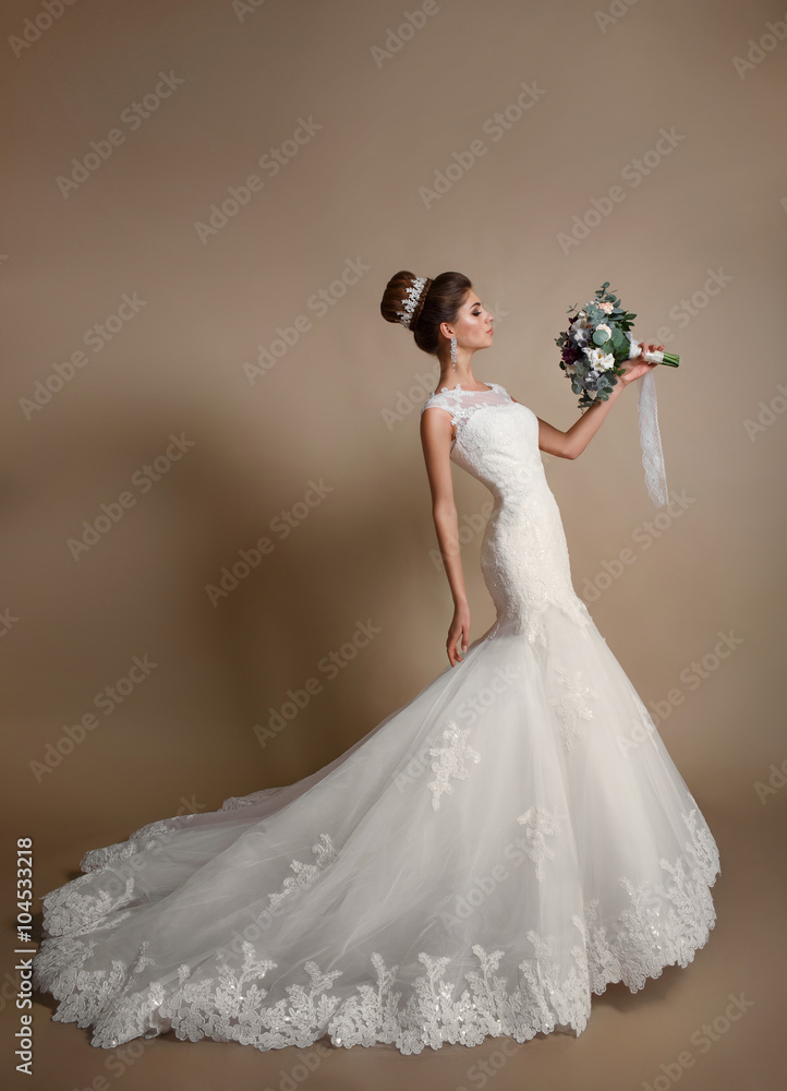 gorgeous bride with crown jewelry , girl in wedding dress fashion model