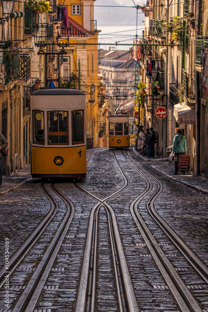 A street scene with crossed tracks and funiculars in Lisbon, Portugal