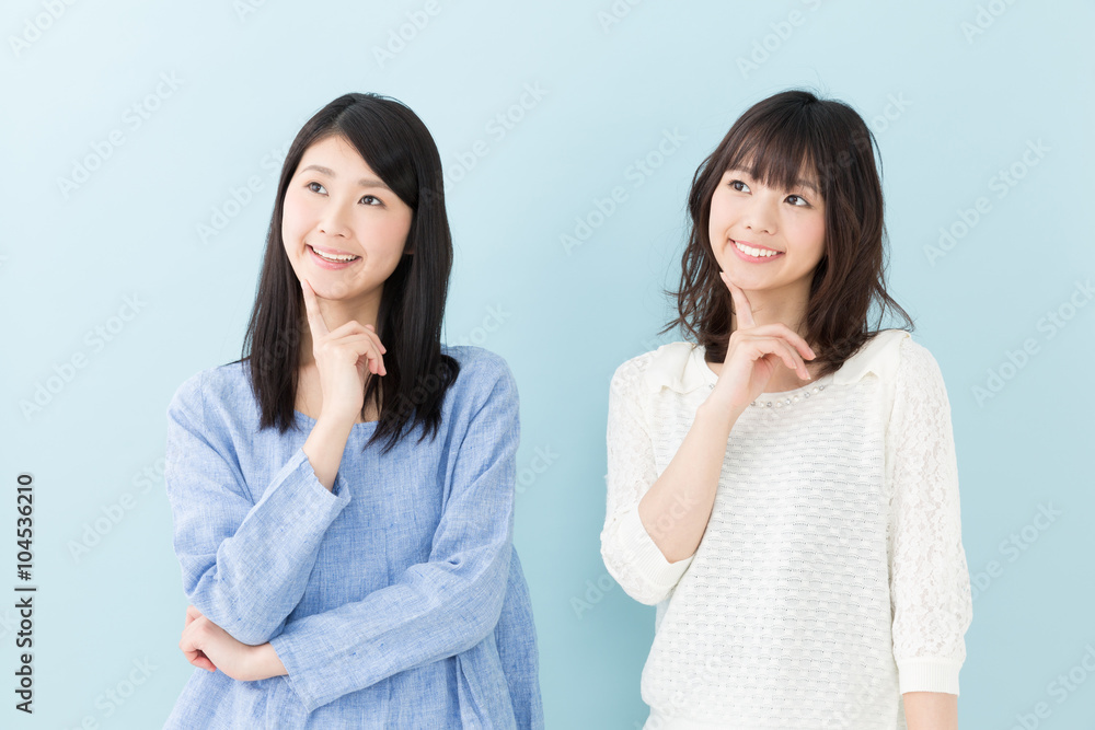 attractive asian women on blue background attractive asian women on blue background