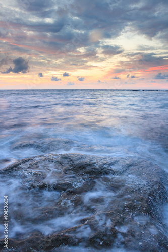 Long exposure sea and rocks at twilight