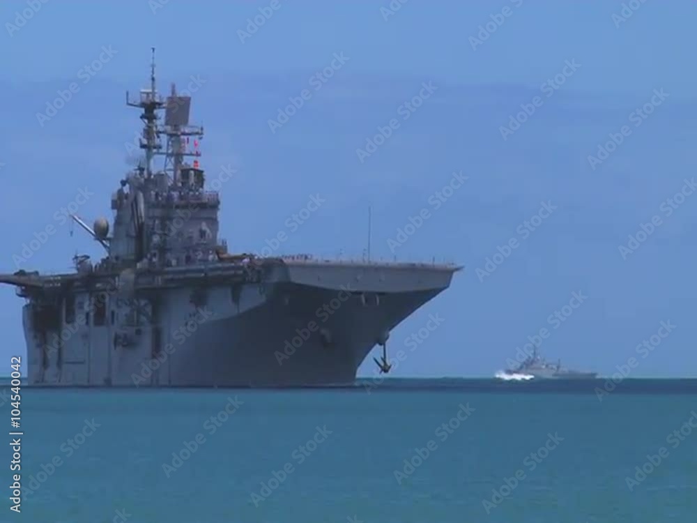 A U.S. Aircraft carrier Bonhomme Richard sails into port near Hawaii.