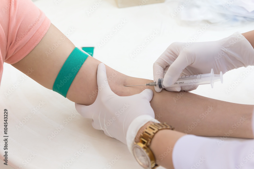 Obraz premium Laboratory with nurse taking blood sample from patient
