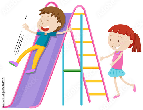 Boy and girl playing on the slide