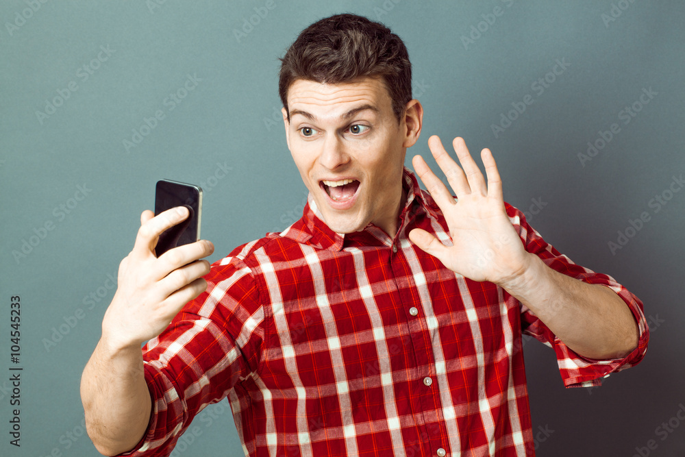 male selfie - thrilled young sportsman saying hello on selfie for fun and wellbeing, green effects....