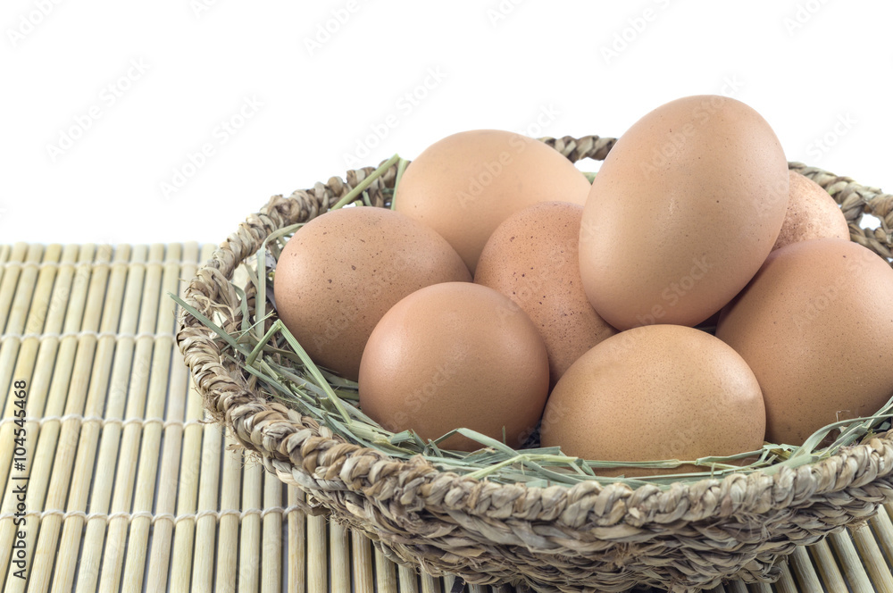 Eggs in basket isolated on white background Eggs in basket isolated on white background