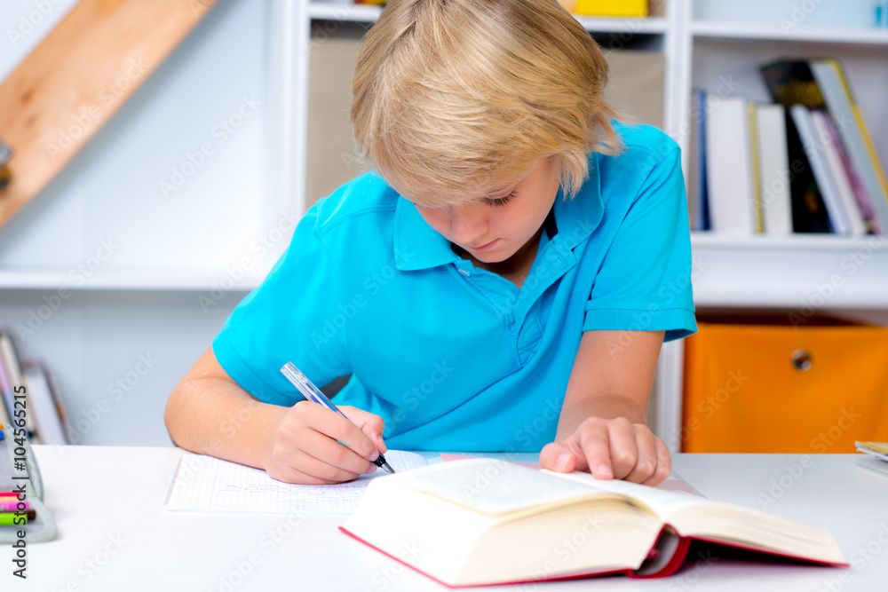 blond boy doing homework blond boy doing homework